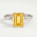 Paris hidden halo engagement ring with an emerald-cut yellow lab-grown sapphire centre stone and diamond accents, front view.