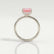 Paris hidden halo engagement ring with a princess-cut morganite-pink lab-grown sapphire centre stone and diamond accents, side profile showing the setting and band.