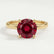 Paris hidden halo engagement ring in 18k yellow gold with a round lab-grown ruby centre stone and diamond accents, front view.