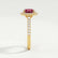 Rosa halo engagement ring in 18k yellow gold with an oval lab-grown ruby centre stone and diamond accents, end-on view showing the setting and band.