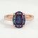 Viola shoulder-set engagement ring in 18k rose gold with an oval lab-grown alexandrite centre stone and diamond accents, front view.