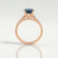 Viola shoulder-set engagement ring in 18k rose gold with an oval lab-grown alexandrite centre stone and diamond accents, side profile showing the setting and band.