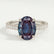 Viola shoulder-set engagement ring in platinum with an oval lab-grown alexandrite centre stone and diamond accents, front view.