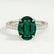 Viola shoulder-set engagement ring in platinum with an oval lab-grown emerald centre stone and diamond accents, front view.