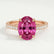 Viola shoulder-set engagement ring in 18k rose gold with an oval pink lab-grown sapphire centre stone and diamond accents, front view.
