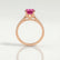 Viola shoulder-set engagement ring in 18k rose gold with an oval pink lab-grown sapphire centre stone and diamond accents, side profile showing the setting and band.