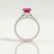 Viola shoulder-set engagement ring in 18k white gold with an oval pink lab-grown sapphire centre stone and diamond accents, side profile showing the setting and band.