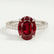 Viola shoulder-set engagement ring in 18k white gold with an oval lab-grown ruby centre stone and diamond accents, front view.