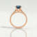Viola solitaire engagement ring in 18k rose gold with a round lab-grown alexandrite centre stone, side profile showing the setting and band.