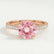 Viola solitaire engagement ring in 18k rose gold with a round morganite-pink lab-grown sapphire centre stone, front view.