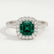 Violette halo engagement ring with a cushion lab-grown emerald centre stone and diamond accents, front view.