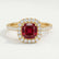 Violette halo engagement ring in 18k yellow gold with a cushion lab-grown ruby centre stone and diamond accents, front view.
