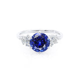 ALYA - Chatham® Round Blue Sapphire Starburst Cluster Shoulder Set Engagement Ring 18k White Gold