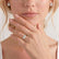 Video showing the Comet Toi et Moi engagement ring with emerald-cut and pear-shaped moissanite stones worn on a model's hand.
