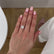 Paris 2.52ct 9x7mm Emerald Cut D-F Colour Charles & Colvard Forever One Moissanite 950 Platinum Hidden Halo Ring Lily Arkwright 