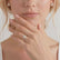 Video of the Coco marquise lab-grown diamond triple pavé hidden halo engagement ring in 18k yellow gold worn on a hand.