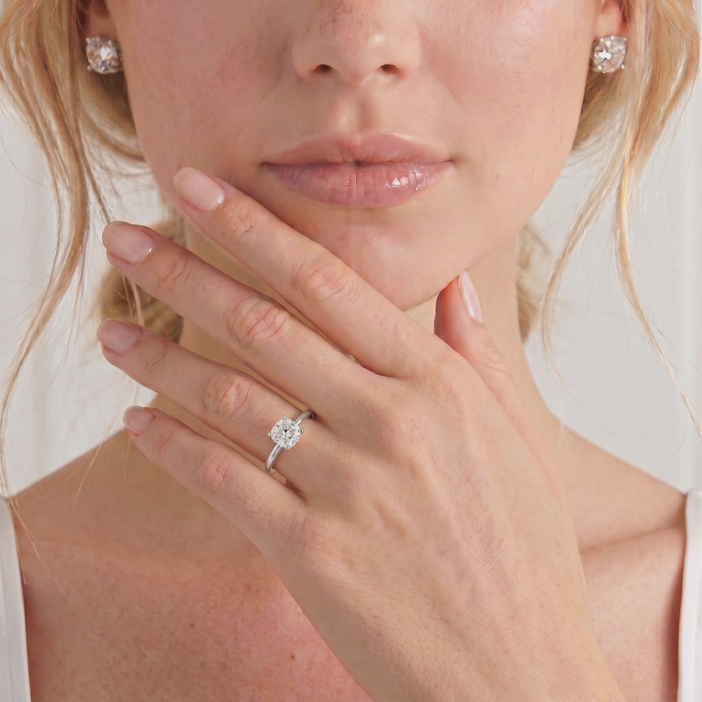 Video of the Paris cushion lab-grown diamond hidden halo engagement ring worn on a hand.