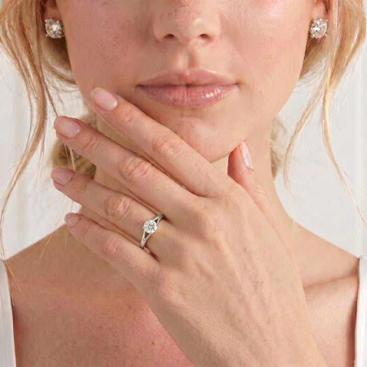 Video showing the Dahlia split-shank solitaire engagement ring with a round moissanite centre stone worn on a model's hand.