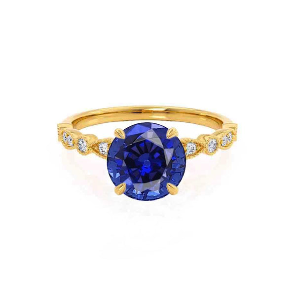 Hope Round cut blue sapphire lab diamond engagement ring 18k Yellow gold marquise shoulder set by Lily Arkwright 