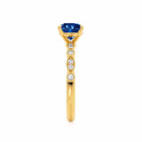Hope brilliant round cut blue sapphire and diamond engagement ring 18k yellow gold marquise shoulder set with milgrain Lily Arkwright 