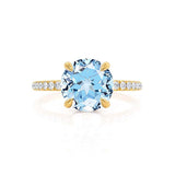 Lively yellow gold shoulder set Chatham round aqua spinel diamond engagement ring Lily Arkwright 