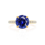 Lively yellow gold shoulder set Chatham round blue sapphire diamond engagement ring Lily Arkwright 