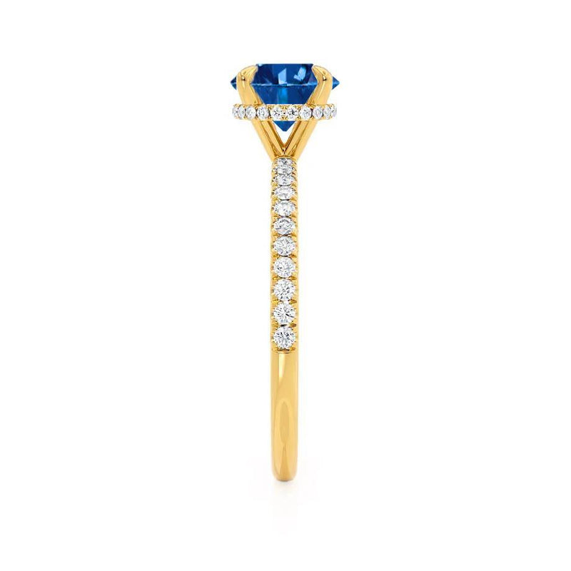  Lively brilliant round cut blue sapphire and diamond engagement ring yellow gold shoulder set Lily Arkwright 