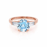 LOVETTA - Round & Baguette Chatham® Aqua Spinel 18k Rose Gold Trilogy Engagement Ring Lily Arkwright