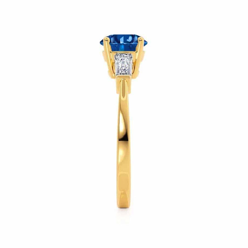 LOVETTA - Round & Baguette Chatham® Blue Sapphire 18k Yellow Gold Trilogy Engagement Ring Lily Arkwright