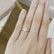 Video showing a round gemstone engagement ring worn on a model's hand.